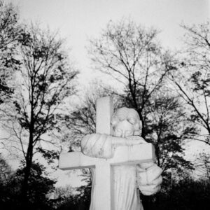 Monochrome image of an angel statue in a cemetery, Saint Petersburg.